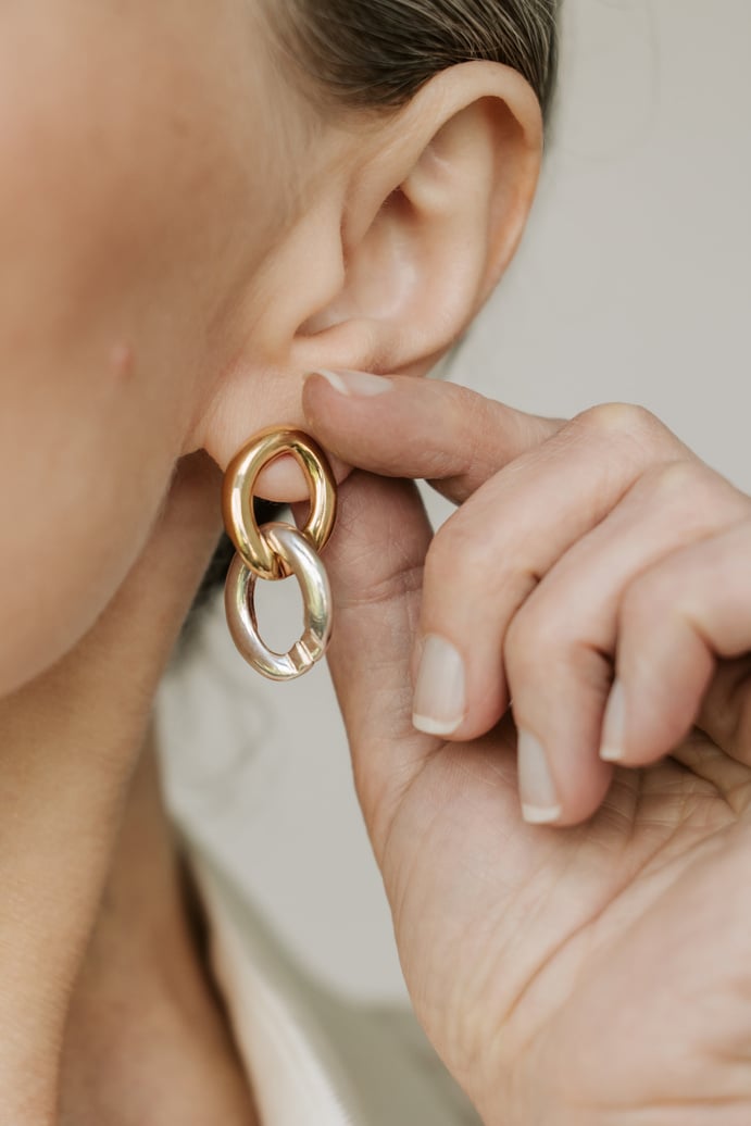 Woman Waring a Gold Earring